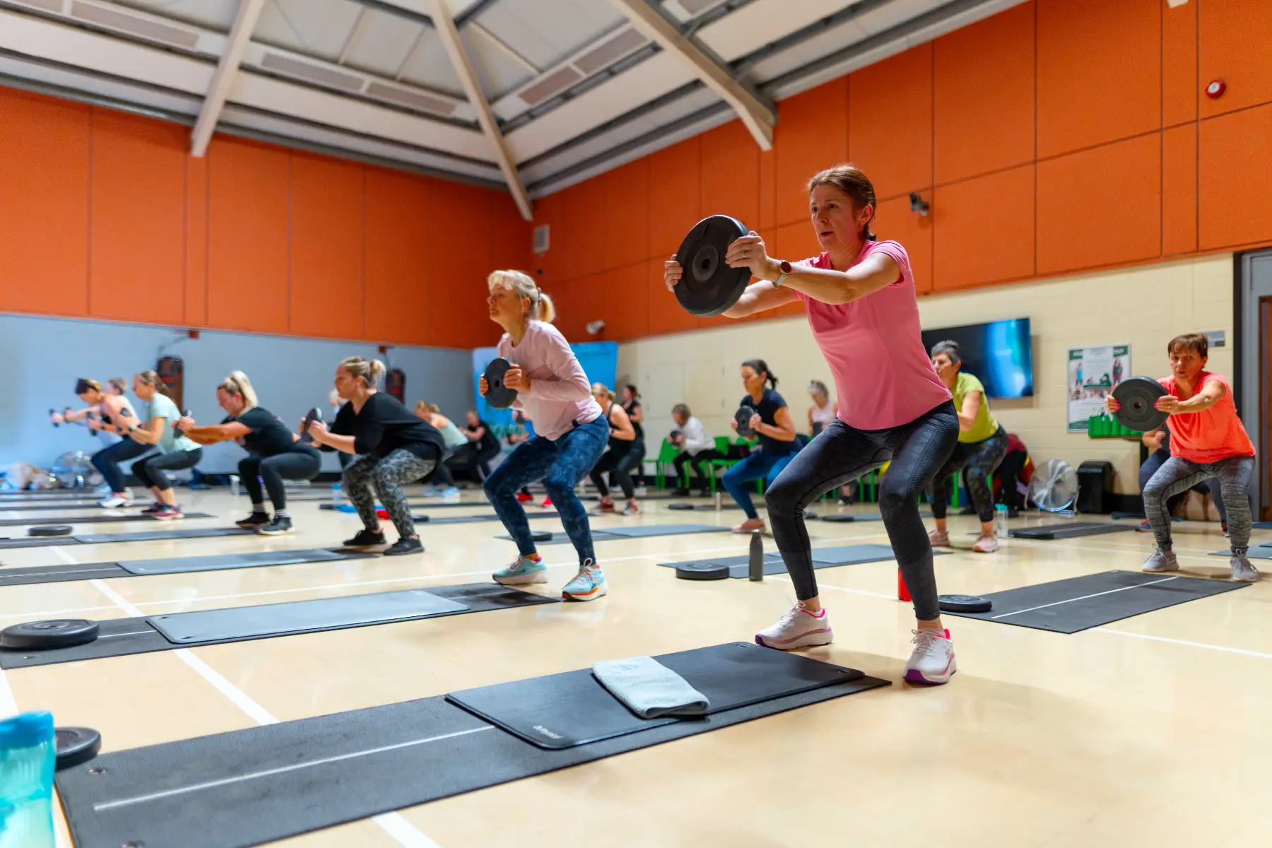 A group of people doing a workout class