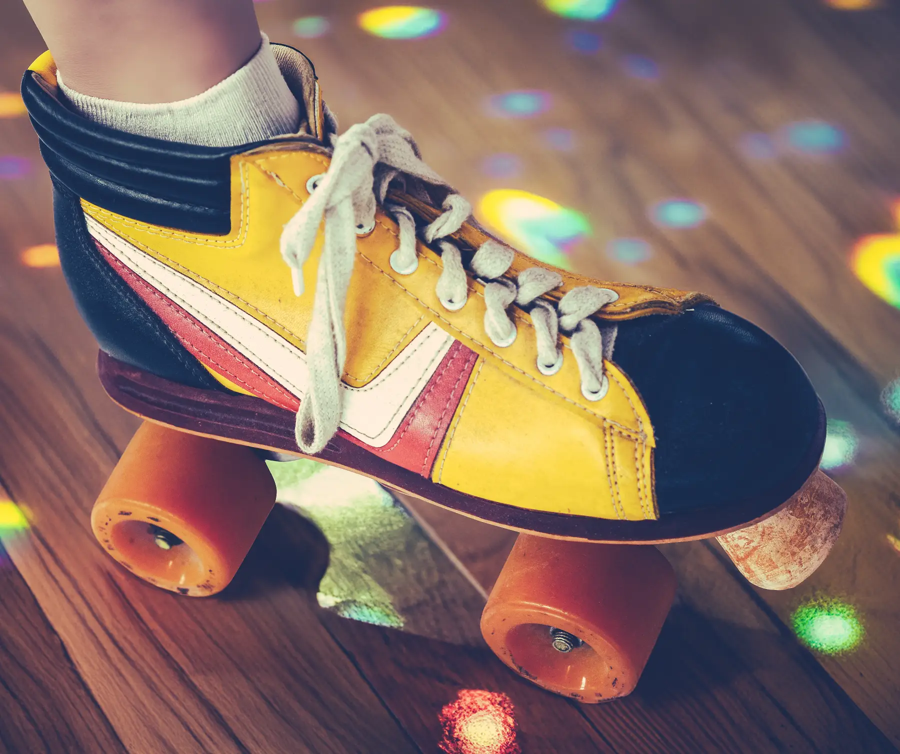 A roller skate on a wooden floor