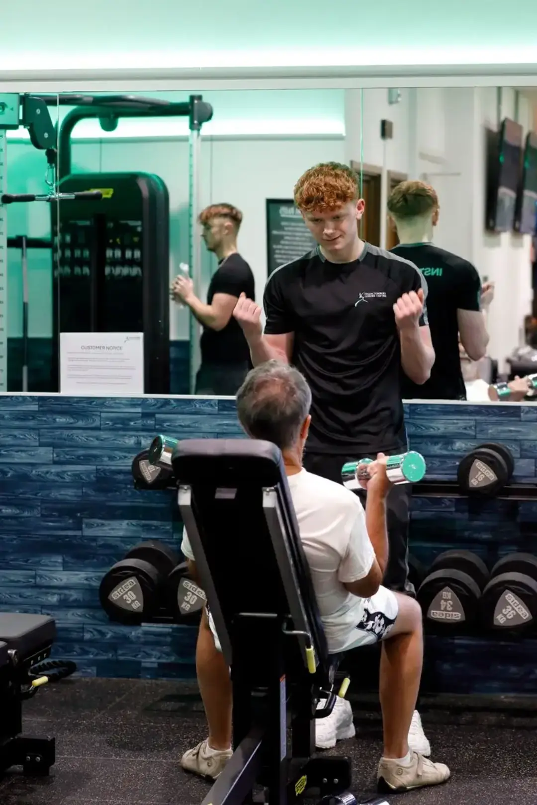 Members working out on gym equipment